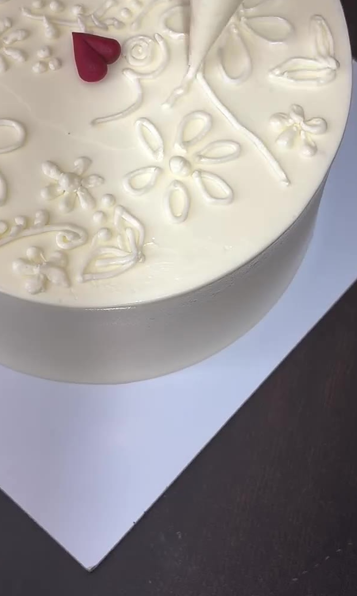 Close-up of delicate floral piping work